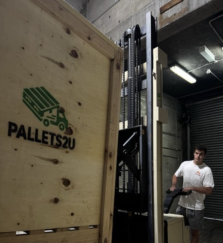 Pallets2U branded wooden storage crate in warehouse